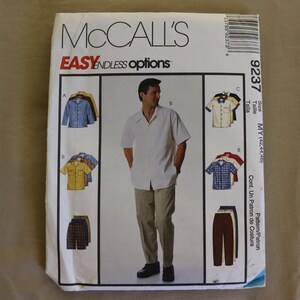 May include: McCall's sewing pattern showing a man in a white short-sleeved shirt and beige trousers. The pattern includes various shirt and trouser styles. The text "EASY ENDLESS options" is visible at the top.