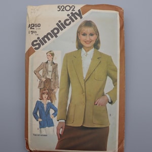 May include: Vintage Simplicity sewing pattern featuring a woman in a light green blazer with a brown skirt. The pattern includes illustrations of different blazer styles. The word "Simplicity" is printed in large letters.