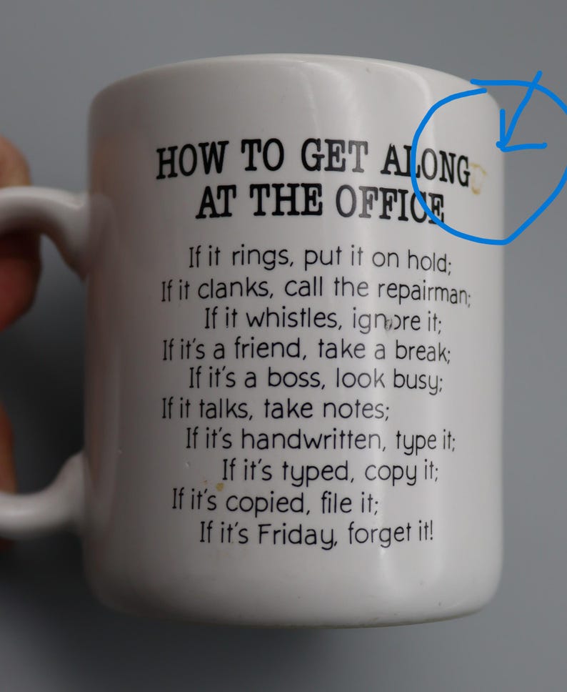 May include: White ceramic mug with a black printed list of office etiquette rules. The mug has a handle and the text reads "HOW TO GET ALONG AT THE OFFICE" followed by humorous instructions. A perfect gift for coworkers.