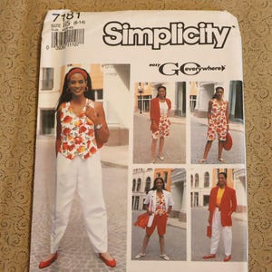 May include: A Simplicity sewing pattern envelope 7181 for a vest, shorts, and pants. The cover features photographs of clothing with a floral print vest, white trousers, and solid-colored blazers. The text includes Simplicity and easy GO everywhere.