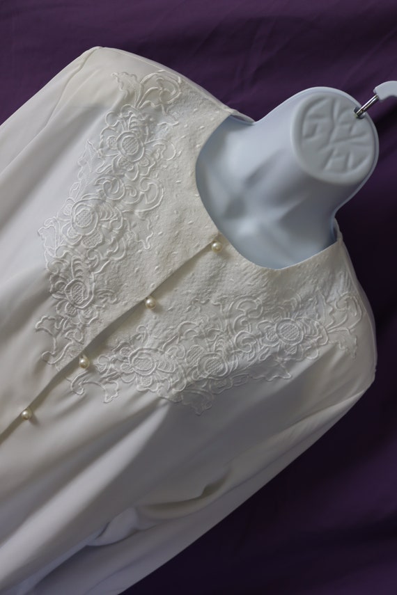 Silky White Blouse with Embroidered Neckline and P