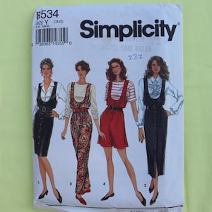 May include: Simplicity sewing pattern with four dress designs. The pattern includes sizes Y (18-22) and EUR Y46-50. The cover shows illustrations of the finished garments, including a black dress, a patterned jumpsuit, and a red dress.