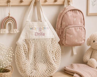 Personalized bag for spare clothes, embroidered with a name, for keeping things organized in kindergarten.