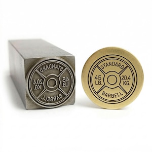 Custom steel punch stamp with brass imprint result - standard barbell 45lb weight plate logo design - high detail custom metal branding stamp for jewelry silversmith goldsmith leatherwork