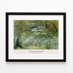May include: Framed print of Vincent van Gogh's "River Bank in Springtime, 1887." The artwork depicts a bridge over a river, surrounded by lush greenery. The print is in a black frame with a white mat.