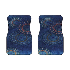 May include: A pair of blue car floor mats with a mandala design in shades of blue, orange, and green.