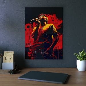 May include: A vibrant, stylized artwork depicts a person singing into a microphone. The image features a bold color palette of red, yellow, and black, with the figure wearing a hat and t-shirt. The background has abstract shapes and the word "BOX".