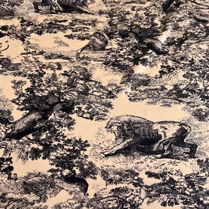 May include: Black and white fabric with a repeating pattern of trees, leaves, and animals. The fabric has a beige background.