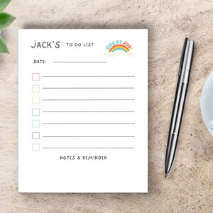 May include: A white to-do list notepad with a rainbow and the text "Great Job!" at the top. The notepad has a section for the date, a list of items with checkboxes, and a section for notes and reminders.