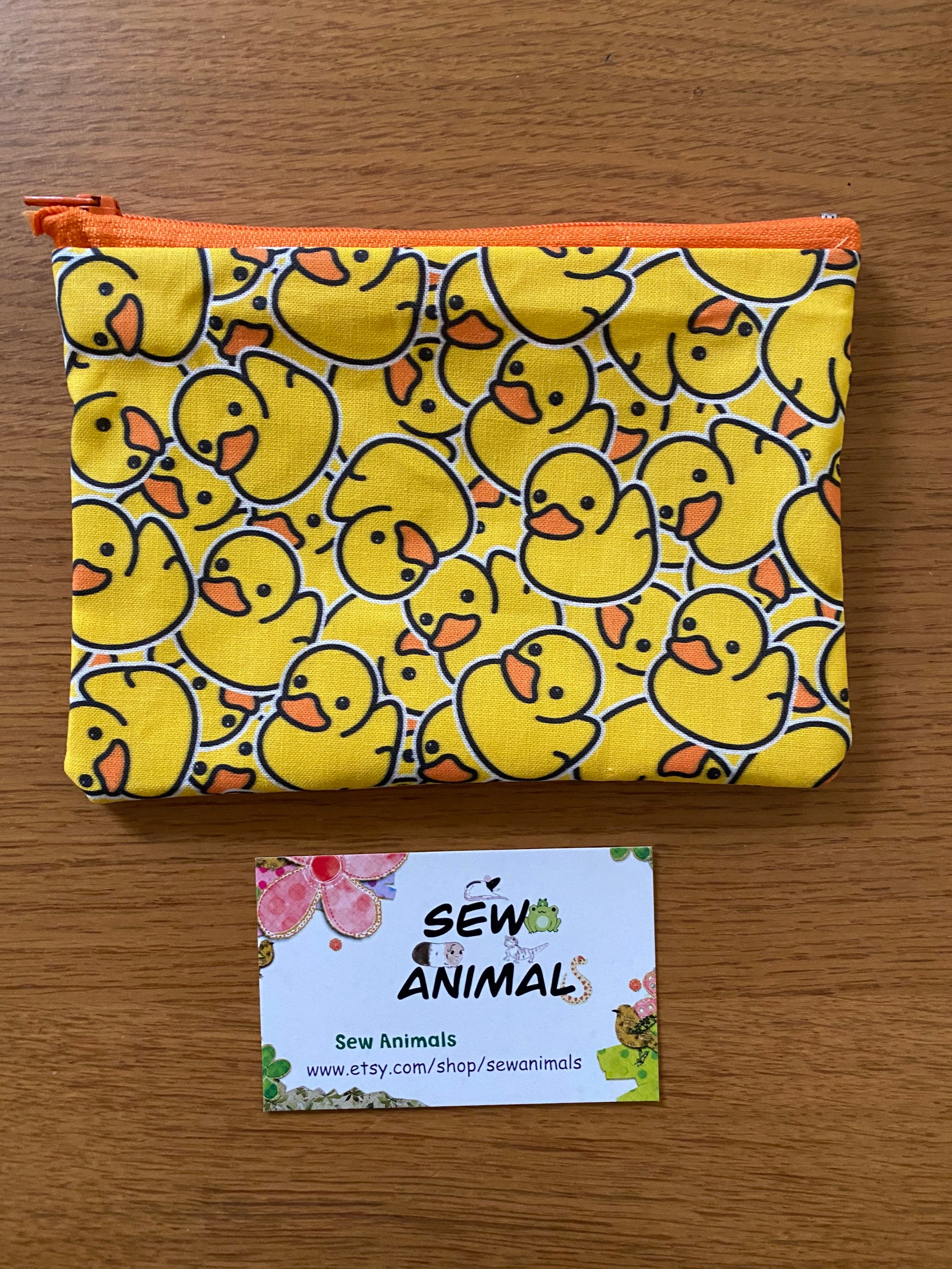 Yellow, silicone duck coin purse with clasp opening • Dimensions