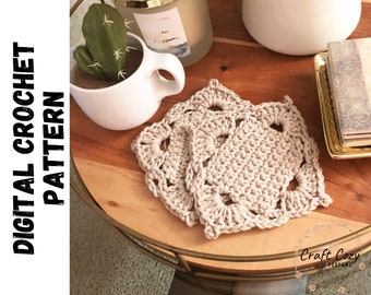 May include: Two beige crochet coasters with a decorative stitch pattern. The coasters are on a wooden surface with a gold metal rim.