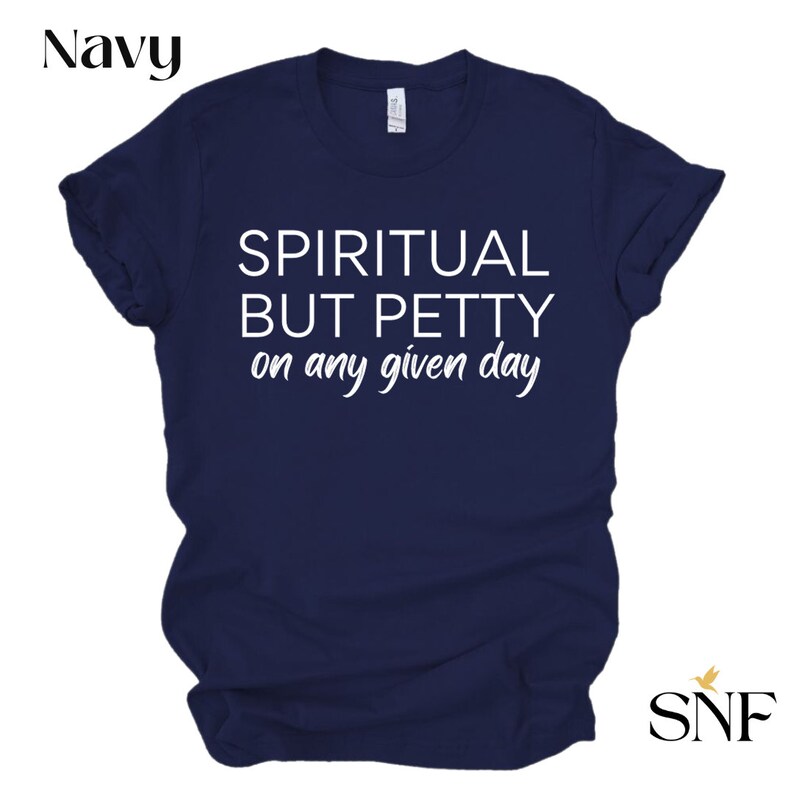 May include: Navy blue t-shirt with white text that reads "Spiritual but Petty on any given day".