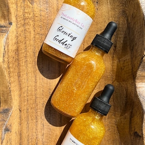 Shimmering body oil. 14k Gold nugget. Glowing Goddess Gold body oil.