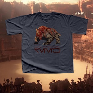 May include: A navy blue t-shirt with a red and brown dinosaur illustration and the text "CIVIV" printed on the front.