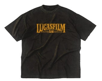 May include: Black t-shirt with a vintage-style orange "Lucasfilm Ltd." logo printed on the front.