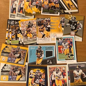 Le’Veon Bell 20 card lot + panini classics material COA memorabilia card /299 Pittsburgh Steelers inserts parallels base Stocking Stuffer