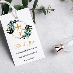 May include: White thank you tag with a gold circle and green leaves around a gold cross with a white dove. The text reads "Thank You" and "For celebrating with us! David's Confirmation May 24th 2023"