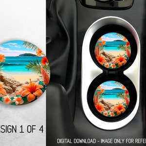 May include: Two round car coasters with a tropical beach scene. The coasters feature a blue ocean, white sand, palm trees, and orange flowers. The coasters are in a car cup holder.