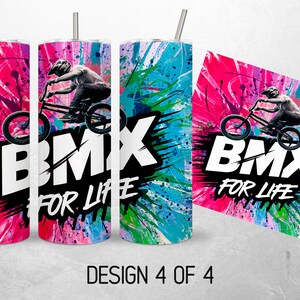May include: A white tumbler with a colorful design of paint splatters and a BMX rider. The text "BMX FOR LIFE" is printed on the tumbler.