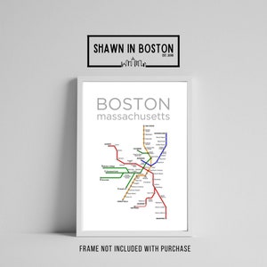 May include: A subway map of Boston, Massachusetts, showing the different lines and stations. The map is in a white frame with the text "BOSTON massachusetts" at the top.
