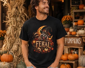 Feral Raccoon Halloween Graphic T-Shirt | Spooky Pumpkin Skull Design