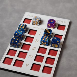 May include: A white game board with red squares and dice in various colours, including blue, purple, and white. The board is labelled "Player 1" and "Player 2" and has Roman numerals I through V.