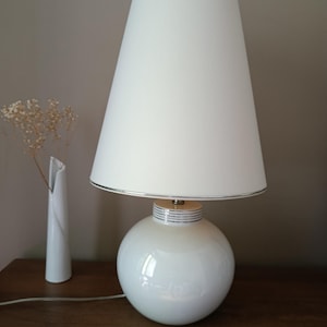 White and silver living room lamp with ceramic ball base and conical shade