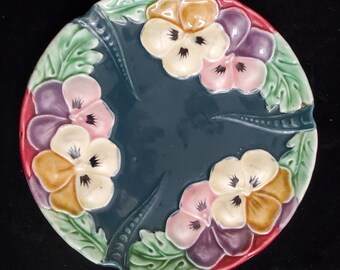 Vintage Majolica Plate with Pink and Yellow Pansies on a Deep Green Background