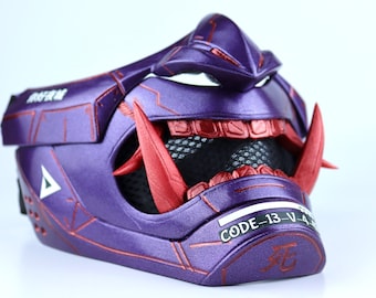 May include: A purple and red plastic mask with a geometric design. The mask has a mesh mouth area and a red, sharp, pointed design on the top and sides. The mask has the text "CODE-13-V-4" and a symbol on the bottom.
