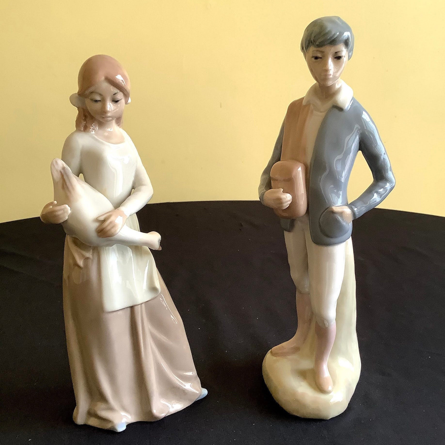 Two Vintage porcelain figurines by Casades Girl holding a Etsy