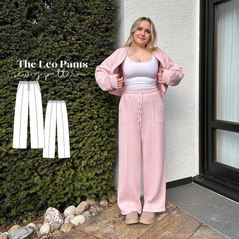 May include: A woman wearing a light pink sweat suit, consisting of a jacket and wide-leg pants. The pants have a drawstring waist. The image also shows a sewing pattern for "The Leo Pants". The woman is wearing a white tank top and tan shoes.