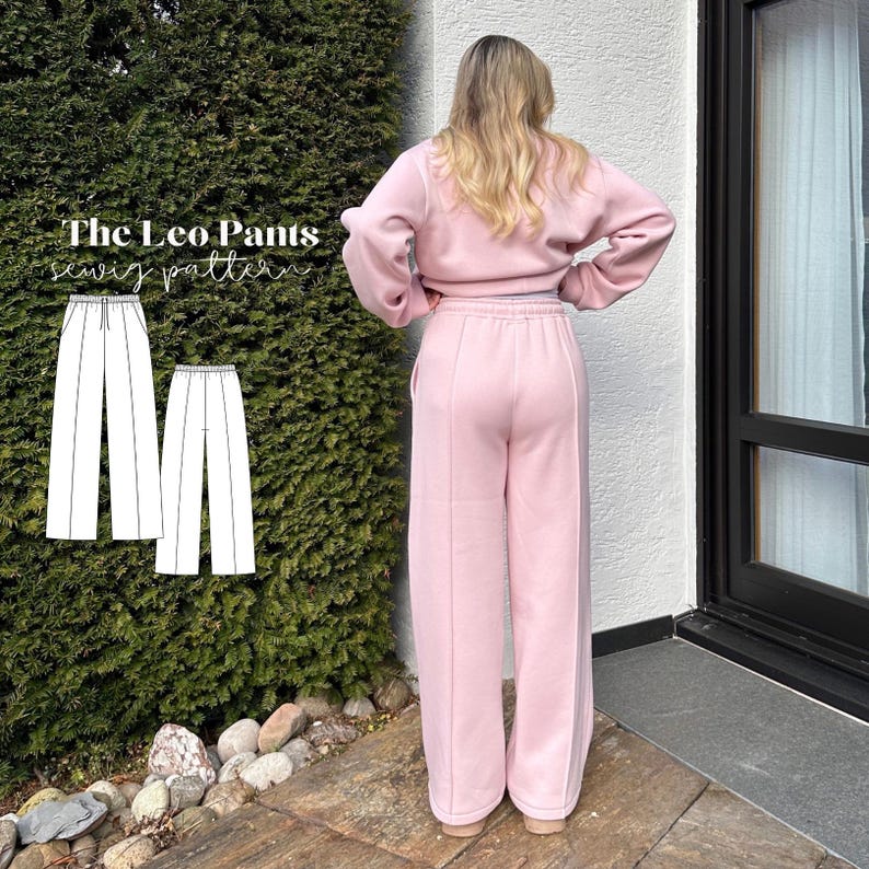 May include: A light pink sweat suit, consisting of a cropped sweatshirt and wide-leg pants. The pants have a high waist and a seam down the front. The image also shows a sewing pattern for "The Leo Pants".