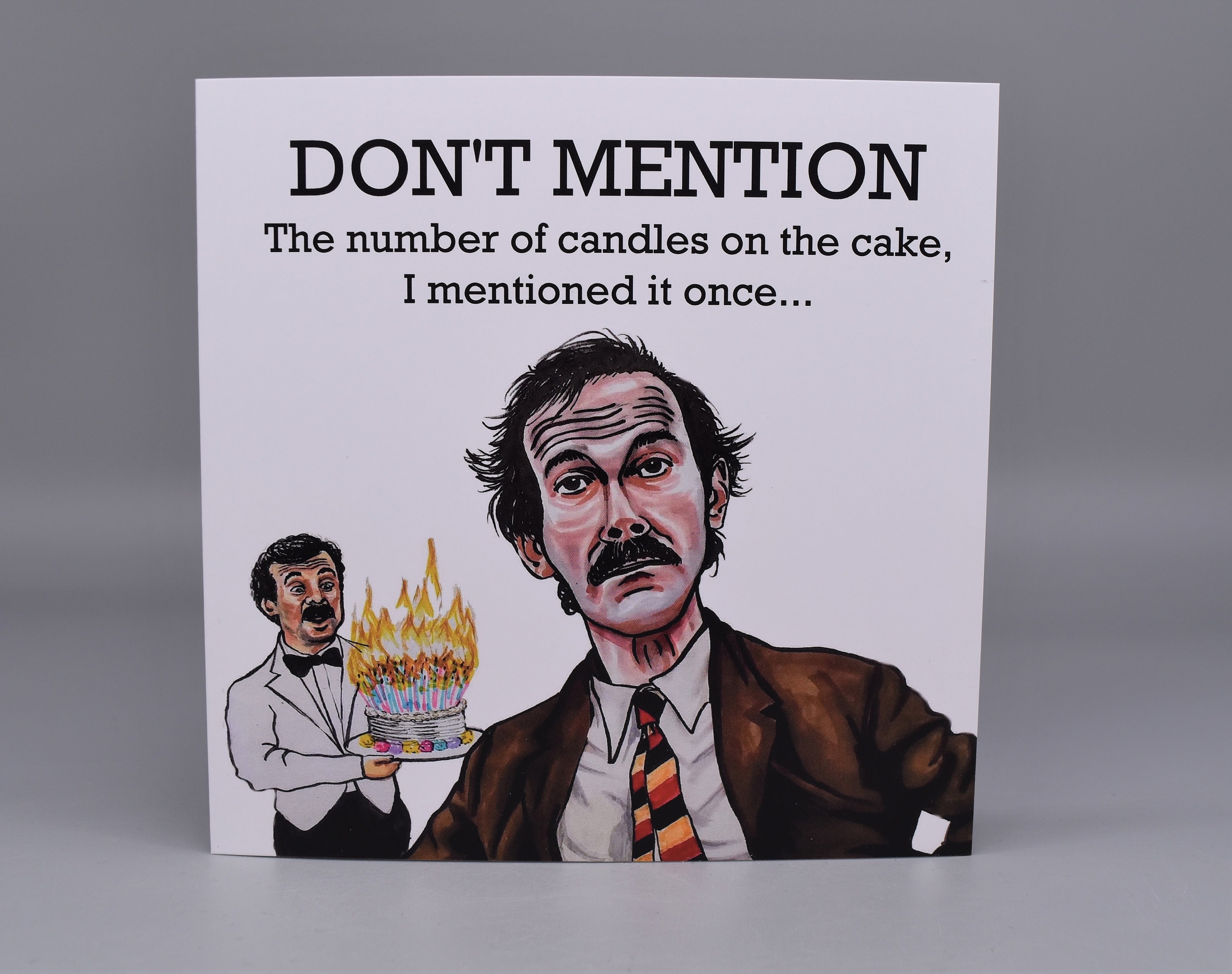 Fawlty Towers Birthday Card. Don't Mention the Number of Candles Basil