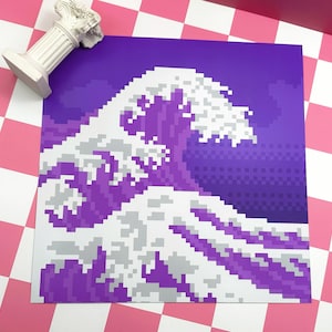 May include: A pixelated art print featuring a stylized wave in shades of purple and white. The artwork is reminiscent of the iconic Great Wave off Kanagawa, with a modern, digital aesthetic. A white decorative column is in the upper left corner.
