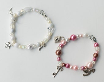 matching beaded bracelets with charms, angel, star, moon, key, pink white