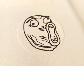 May include: A black and white illustration of a surprised face with a wide open mouth and large eyes. The face is drawn in a simple, cartoon style.