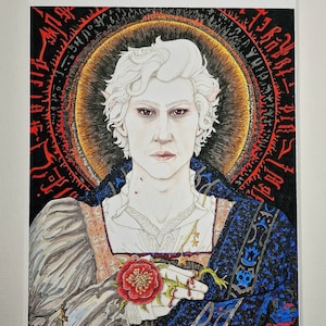 May include: A portrait of a person with white hair and pale skin, wearing a white shirt with a gold chain, a blue and gold robe, and holding a red rose. The background is black with red and gold circles and runes.
