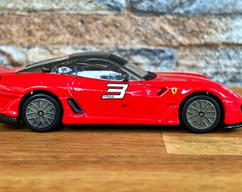 Miniature Ferrari 599XX 1/43 Burago – Métal Rouge – Occasion Avec Traces D'usure