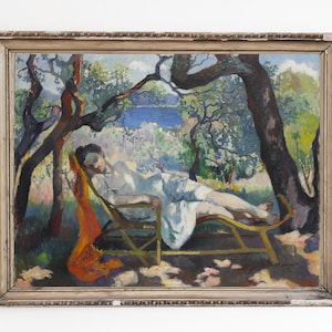 May include: A painting of a woman reclining on a chaise lounge in a lush, green garden setting. The woman is wearing a white dress and has a red scarf draped over her shoulders. The garden is filled with trees and flowers, and there is a view of a blue body of water in the distance.