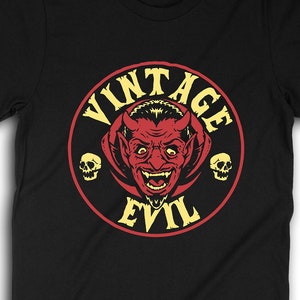 May include: Black t-shirt with a yellow and red circle graphic featuring a red devil head with horns and the text "Vintage Evil".