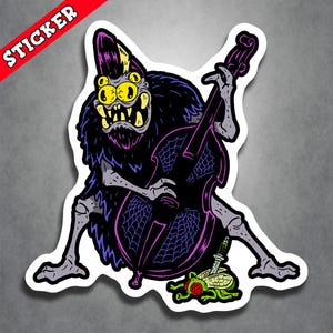 May include: A die-cut sticker featuring a multi-eyed, furry creature with yellow eyes and sharp teeth playing a dark purple upright bass decorated with spider web patterns. A small green fly with a dagger through its body lies at the creature's feet.
