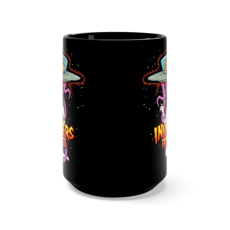 May include: Black ceramic coffee mug with a graphic of a purple alien with a spaceship and the text "Invaders from Hell" on the front.