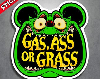 May include: A die-cut sticker featuring a bright green cartoon character with large, wide eyes and a gaping mouth. The text GAS, ASS OR GRASS is printed in bold yellow letters inside the mouth, set against a black background with white teeth.