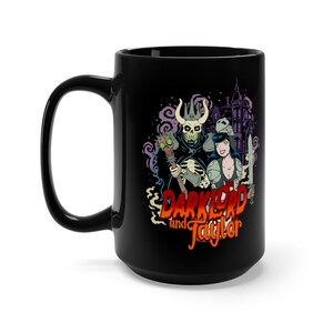 May include: Black ceramic mug featuring a graphic of a skeleton wearing a crown and a woman in armour. The text "Darklord and Jaglar" is printed in orange and red.