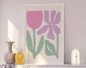 Könnte beinhalten: Ein gerahmter Druck mit einem minimalistischen Design, das zwei stilisierte Blumen in Rosa-, Lila- und Grüntönen vor einem cremefarbenen Hintergrund zeigt.