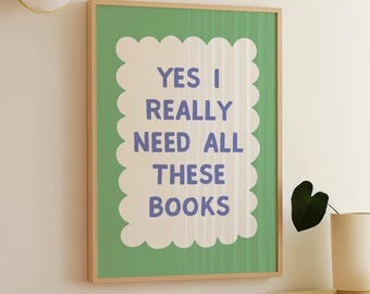 May include: A green framed print with a white border and the text "YES I REALLY NEED ALL THESE BOOKS" in purple text.