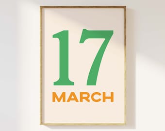 May include: A framed print with a white background and a green number 17 and the word "MARCH" in orange text.