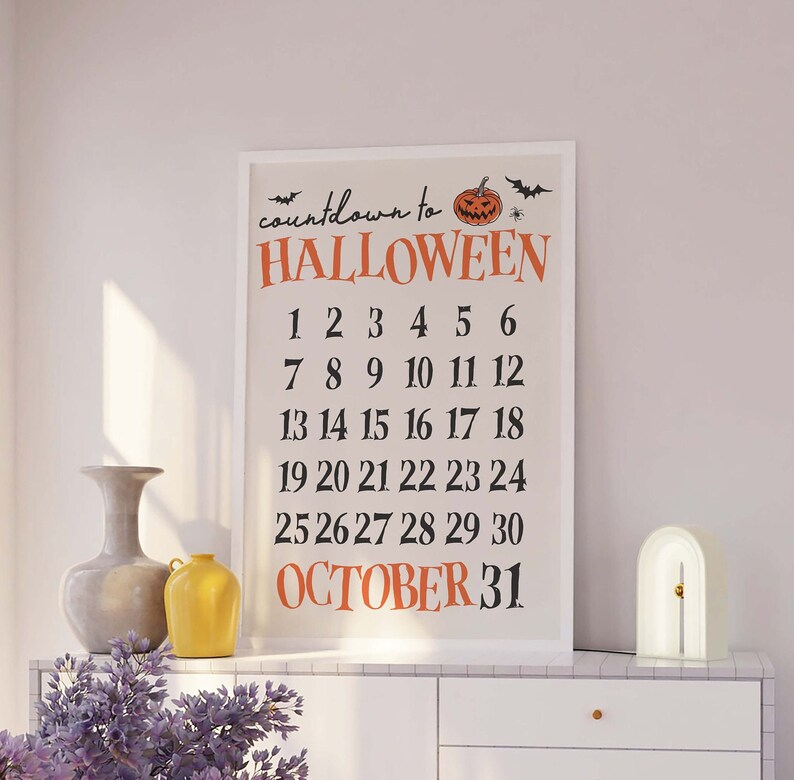 May include: A white framed printable countdown to Halloween with a black and orange pumpkin illustration. The numbers 1 through 30 are listed in rows, with "OCTOBER 31" at the bottom.