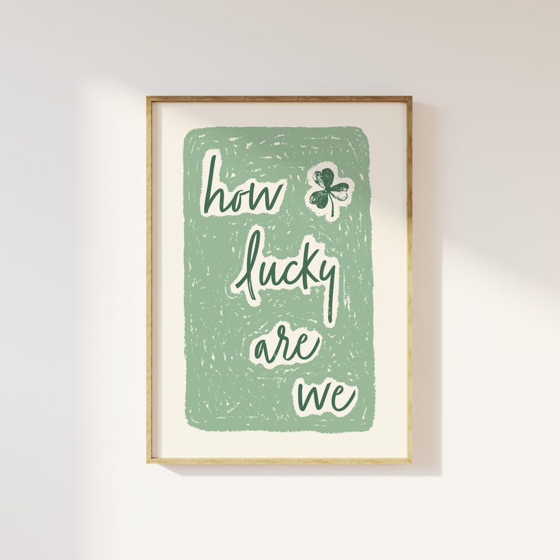 May include: A green and white print with the text "how lucky are we" and a green shamrock.