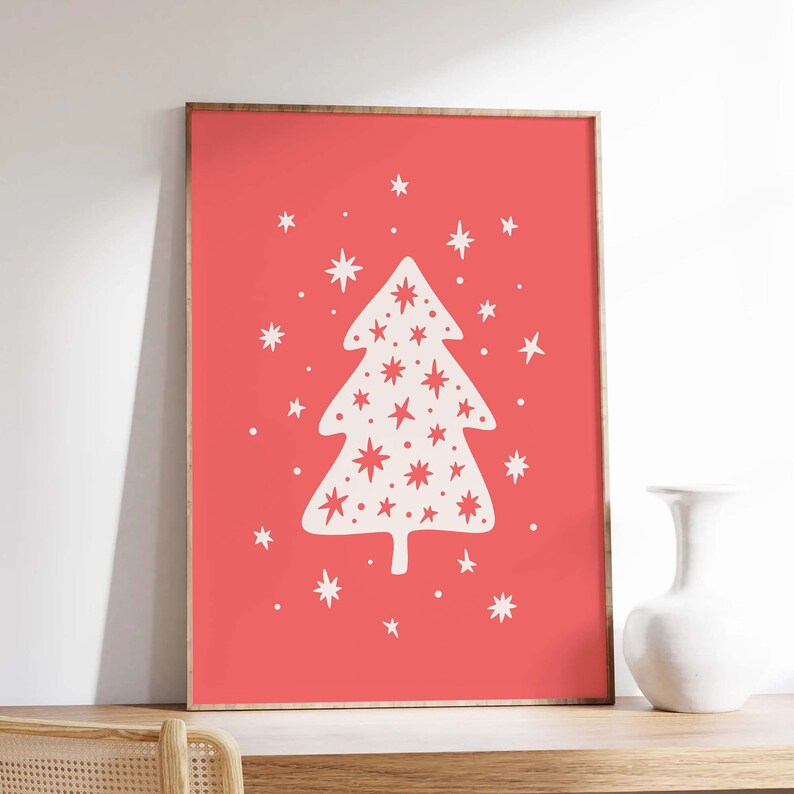 May include: A white Christmas tree with a red background. The tree is decorated with white stars.
